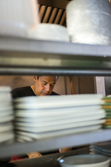 Jorge Castaneda, 47, has been a cook at Las Fajitas since it opened in 1995.  Lopez and Castaneda worked side by side until she took over the restaurant (Photo by Heidi de Marco/KHN).