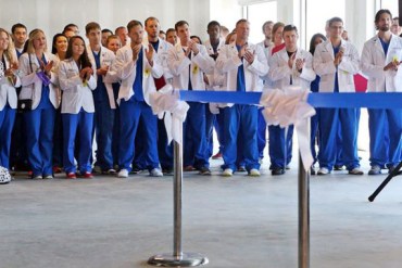 A.T. Still University dental students applaud during the opening speeches and ribbon cutting ceremony for the new St. Louis Dental Education and Oral Health Clinic in St. Louis on Wednesday, June 10, 2015, in St. Louis. The clinic will see its first patients in July. (Photo by J.B. Forbes/St. Louis Post-Dispatch)