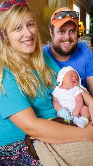 At Blessed Births, a birth center in Greenville, S.C., Kristen Laing, 25 and husband Harrison Laing, 29, from Greenville hold baby Elijah, about a week after he was born. The downtown center is owned and run by a certified professional midwife (Photo by Phil Galewitz/KHN).
