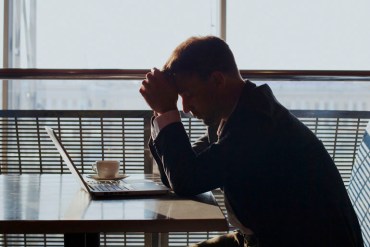 depressed businessman with laptop