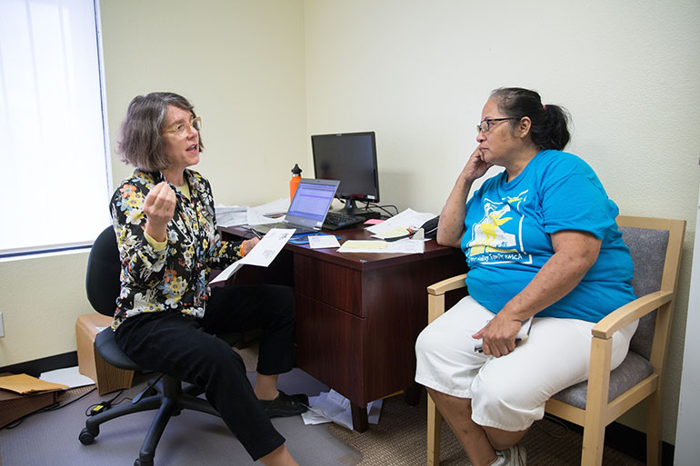 Laura Castillo, right, learns about treatment of her hepatitus C infection from Dr. Katie Moizeau Thursday, March 3, 2016 during a weekly clinic in Sacramento.