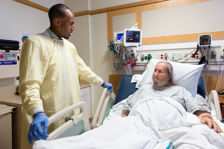 Pharmacist Dominick Bailey explains medication changes to patient Will Carter at the UCLA Medical Center in Santa Monica, California, on Thursday, May 5, 2016. The 79-year-old was admitted to the hospital with intense leg pain and worries he might mix up his medicine after he is discharged . (Heidi de Marco/KHN)