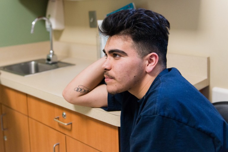 Steven Amador, 18, waits in the exam room with fiancé Serenity Thomason on Thursday, February 2, 2017. Amador said he feels lucky he hasn’t contracted an STD. “I feel like I got through a land mine in Bakersfield.” (Heidi de Marco/KHN)