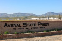 large sign reading Avenal State Prison