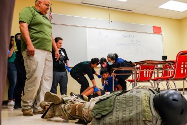 A photo shows staff from the Brownsville Independent School District participating in an active shooter drill.