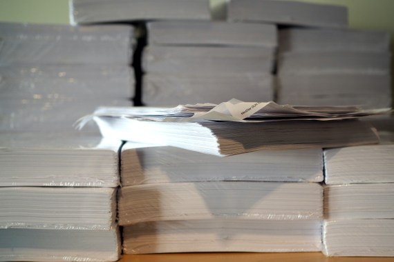 several large files of medical record documents most wrapped in plastic except those in the foreground