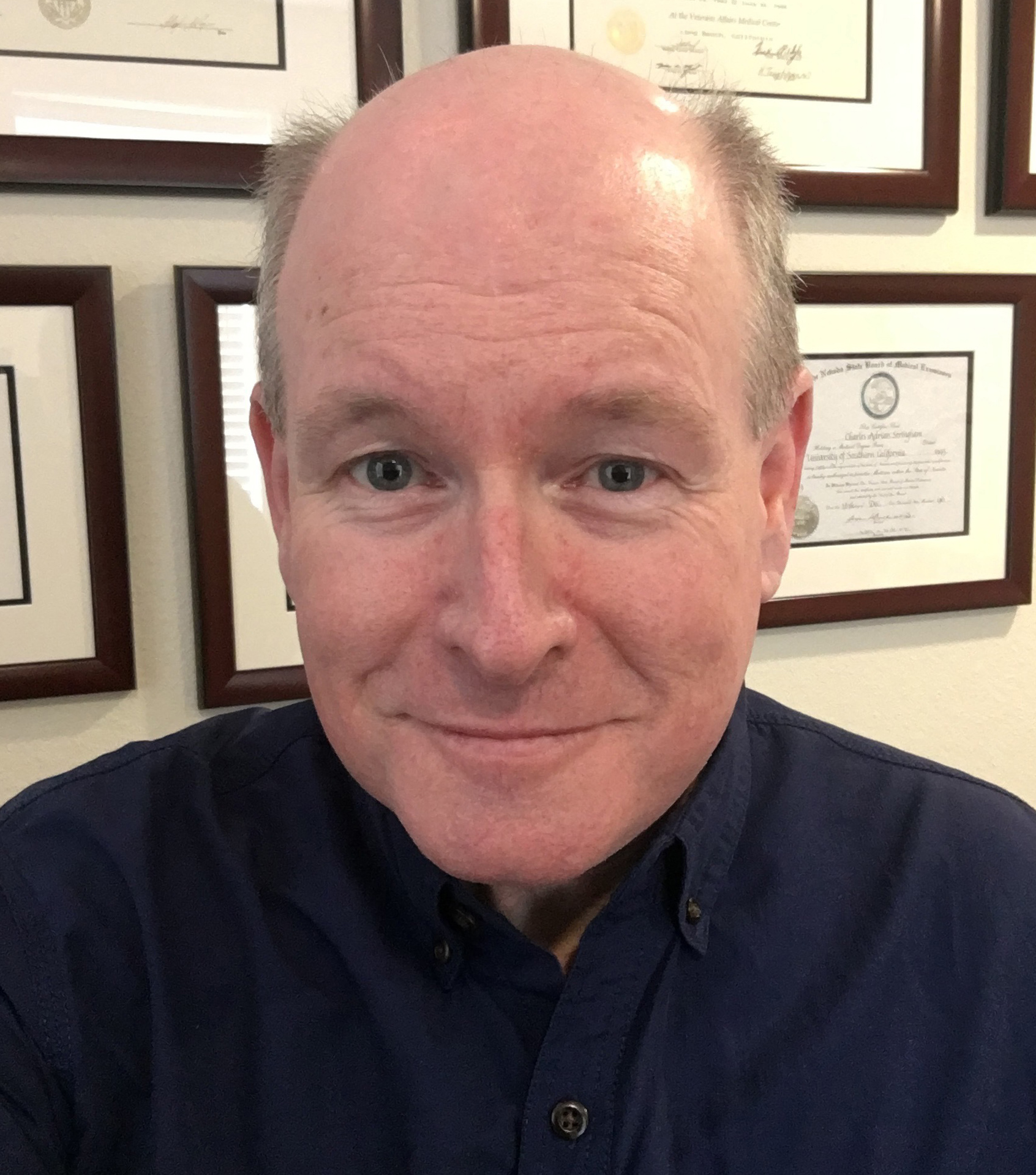 A photo shows a selfie of Dr. Charles Stringham.