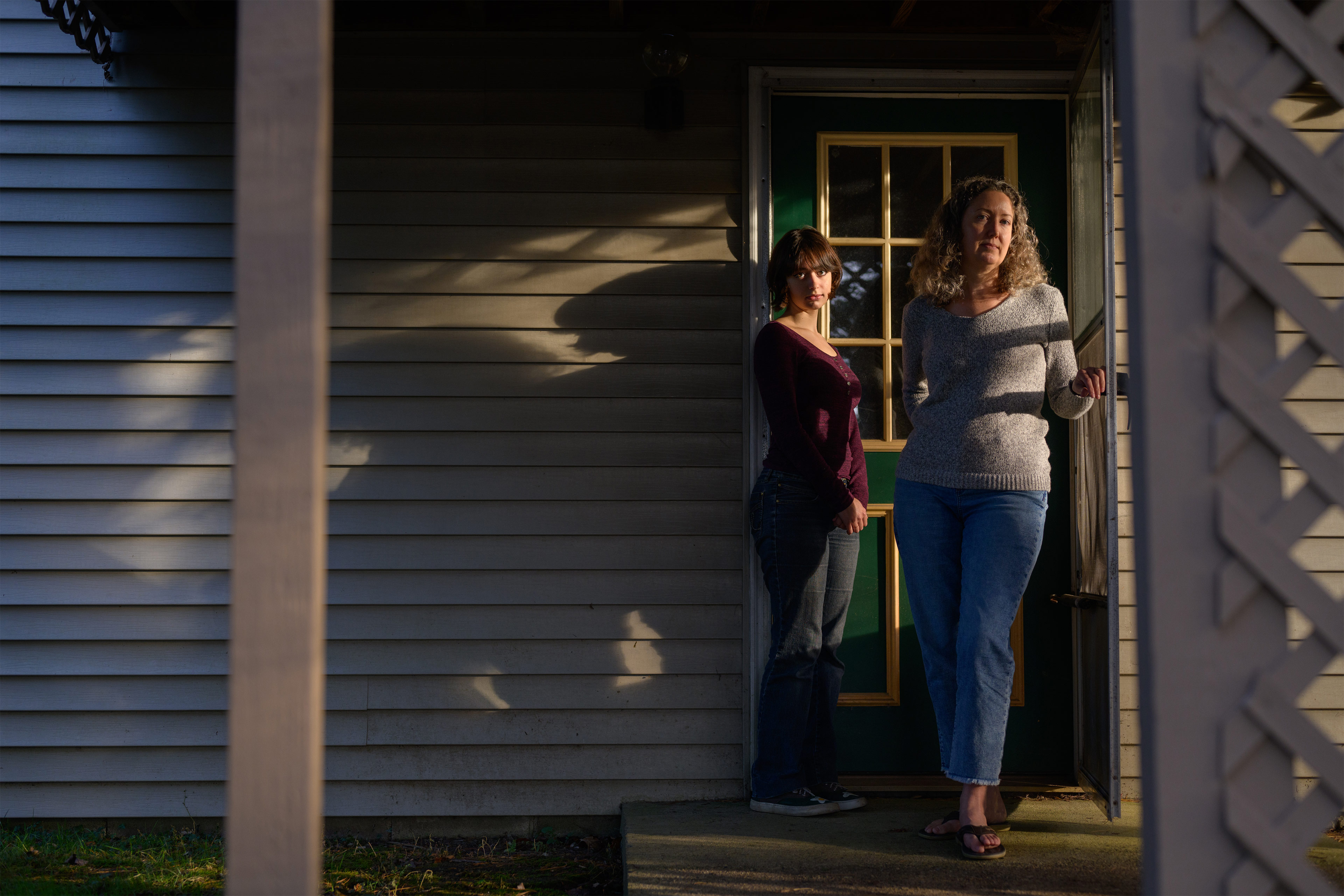 A photo shows Hawley Montgomery-Downs posing with her daughter Bryn outside their home.