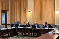 A photo shows a Montana Senate committee meeting.