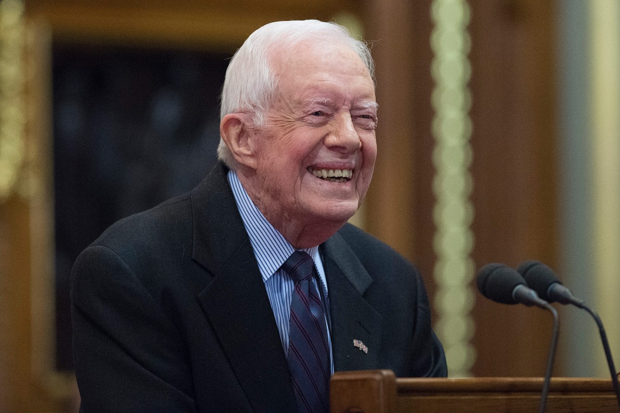 A photo of Jimmy Carter at a podium.