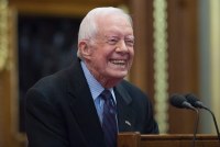 A photo of Jimmy Carter at a podium.