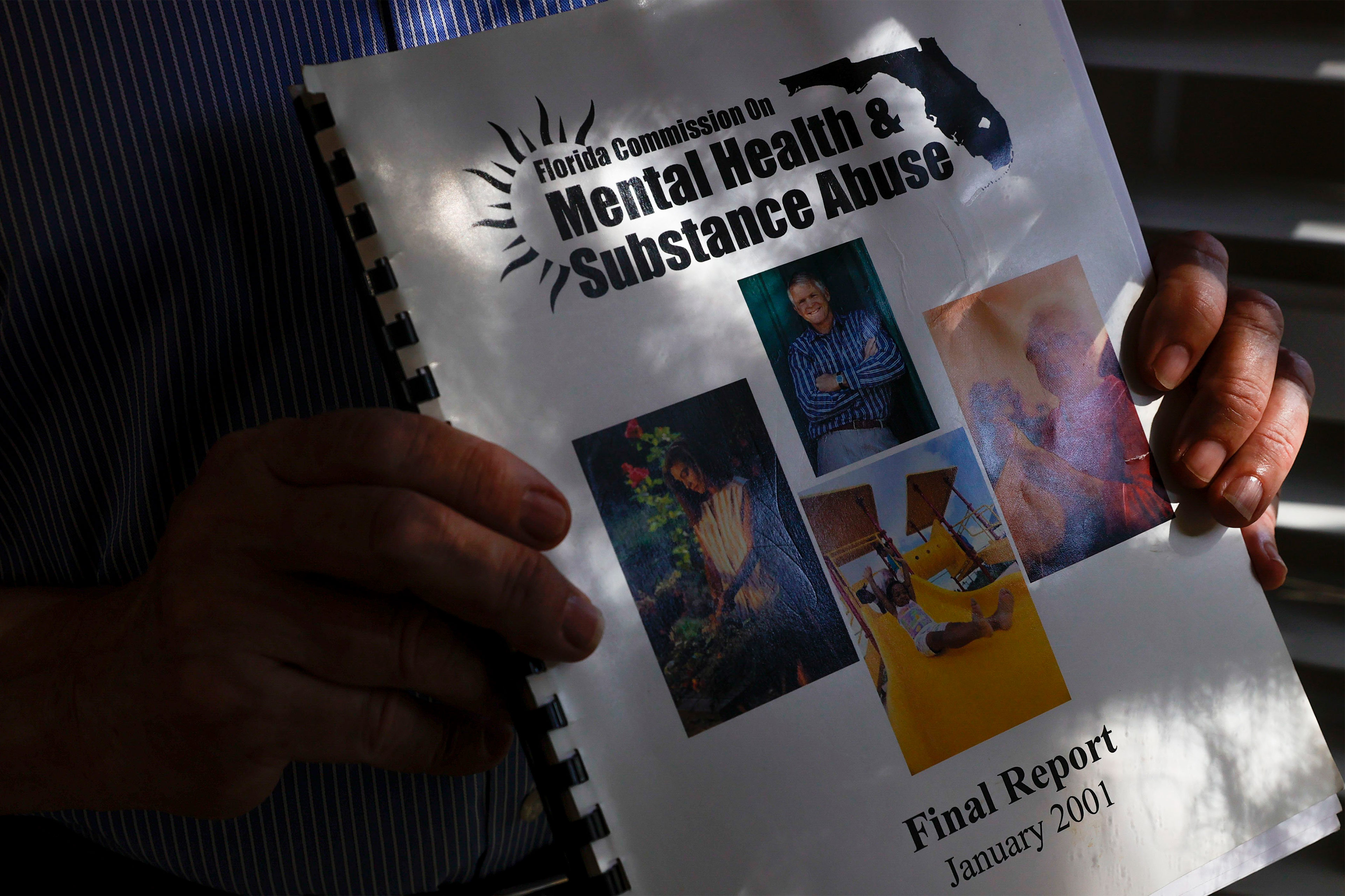 A close-up photo of the Florida mental health commission report released in 2001.